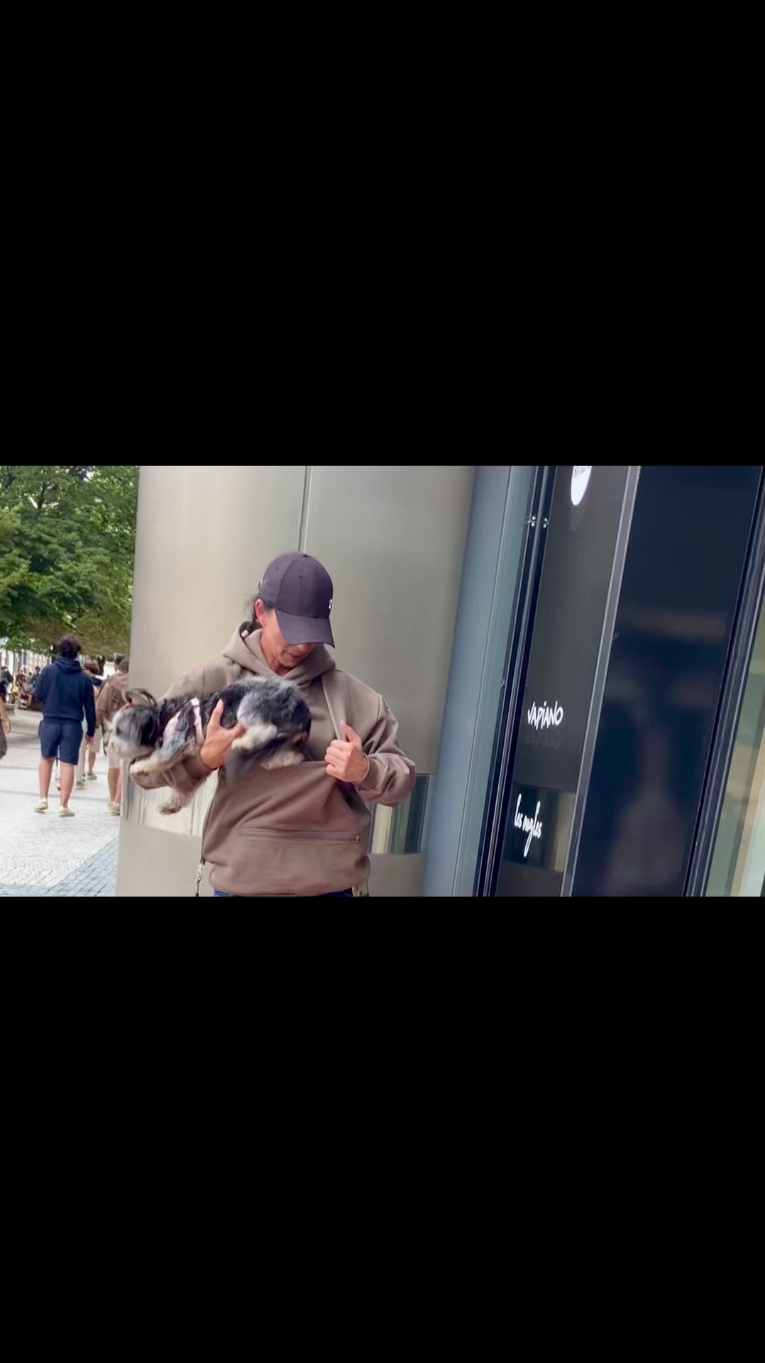 Load video: A minimalist, oversized hoodie with a hidden pocket made to keep your small dog close, calm, and comfortable, while you stay stylish, hands-free, and ready for life on-the-go